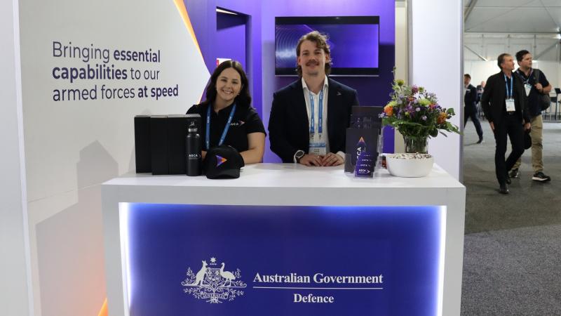 ASCA team members at expo stand